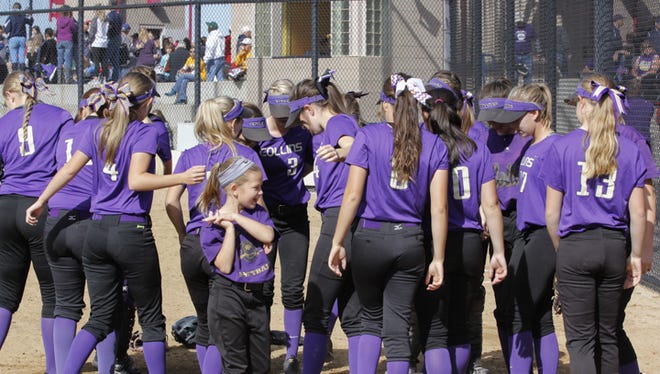 The Fort Collins softball team readies for game last season. The Lambkins, along with the other city teams, play in the Triple Crown Sports softball tournament this weekend.