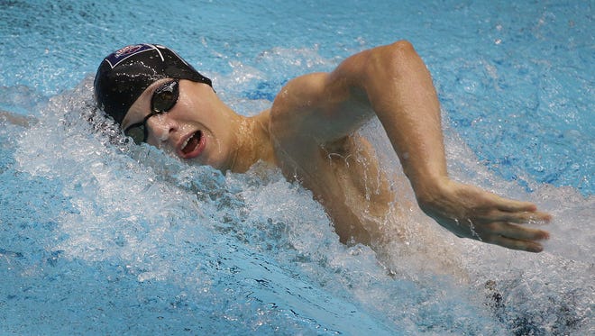 FILE – Drew Kibler set a national record at Day 1 of the IHSAA swimming state finals.