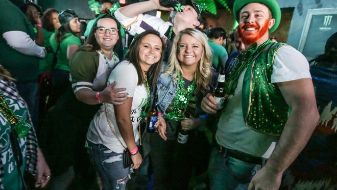 Friends from Monrovia celebrate St. Patrick's Day weekend at Tiki Bob's in downtown Indianapolis, March 18, 2017.  Revelers made their way through downtown Indy for the Indianapolis 2017 St. Pat's two day Bar Crawl, and NCAA Mens Basketball Tournament.