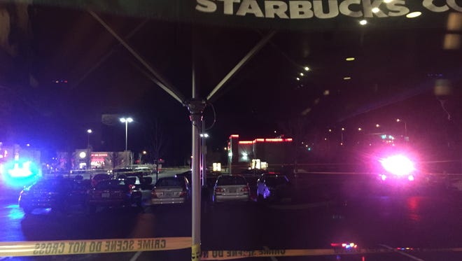 Police investigating a shooting in a parking lot at Keizer Station.