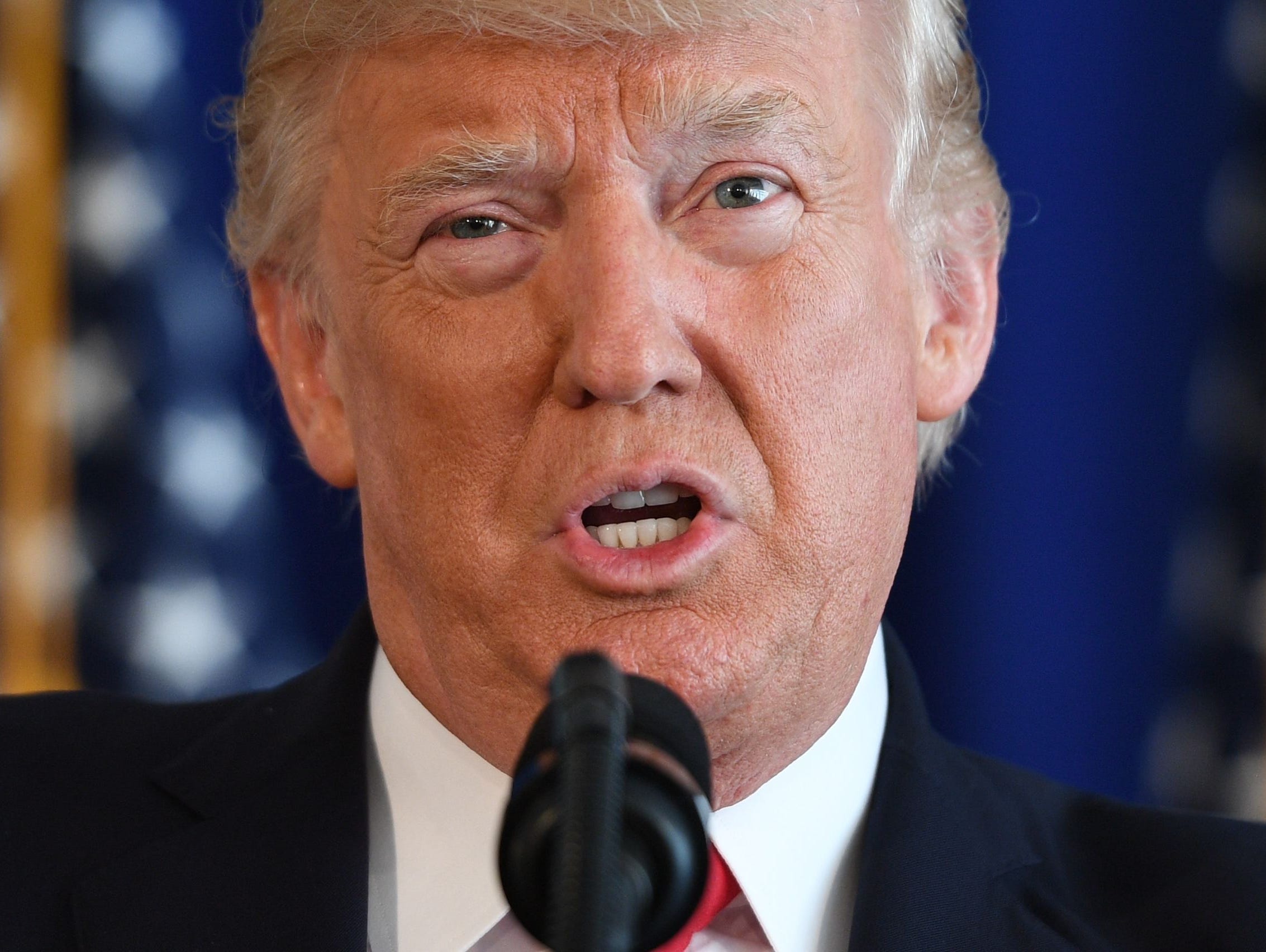 This photo taken on August 12, 2017 shows President Trump speaking to the press about protests in Charlottesville at Trump National Golf Club in Bedminster, New Jersey.