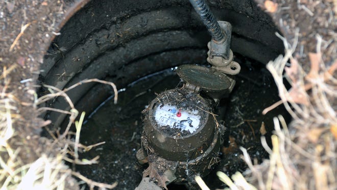 A residential water meter that measures water usage in cubic feet. City council will be considering an ordinance change to allow residents, or people working for residents, to open their own water meter boxes.