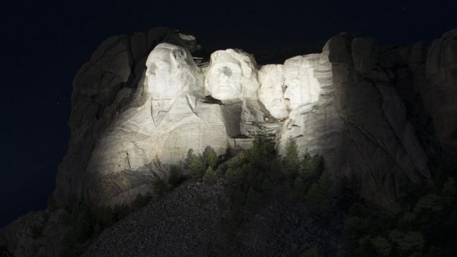 Lights from Musco Lighting shine on Mount Rushmore.