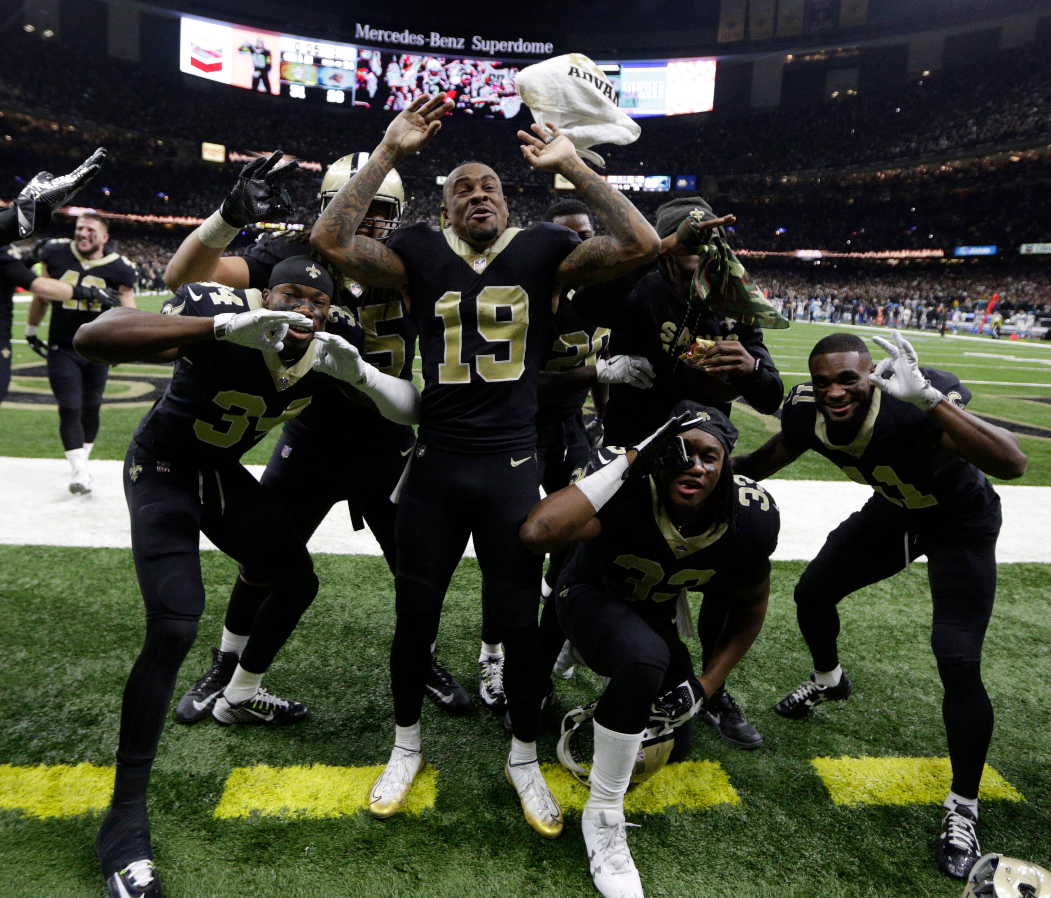 New Orleans Saints wide receiver Ted Ginn (19) and teammates react after defeating the Carolina Panthers in the NFC Wild Card playoff football game at Mercedes-Benz Superdome.