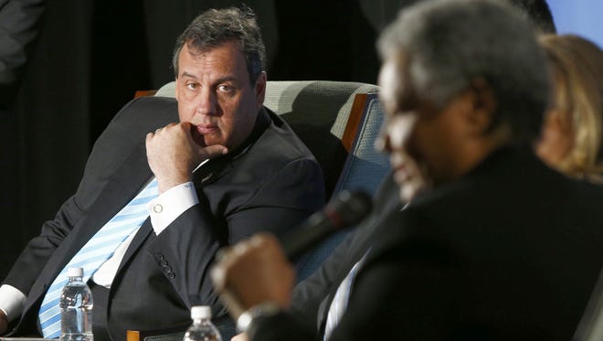 Gov. Chris Christie listens Thursday during the  “Solutions for a New Way Forward” panel discussion at Jersey Shore University Medical Center in Neptune.