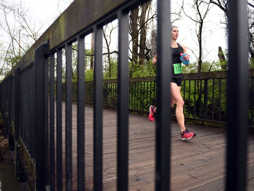 Eva Crawford crosses over the Third Creek Greenway