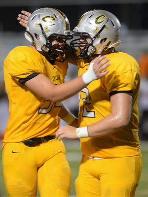 Calvary's David Fitzwater (left) is congratulated by Jaise Young after a Fitzwater recovered a fumble in the second quarter of their game against Parkway in 2014.
