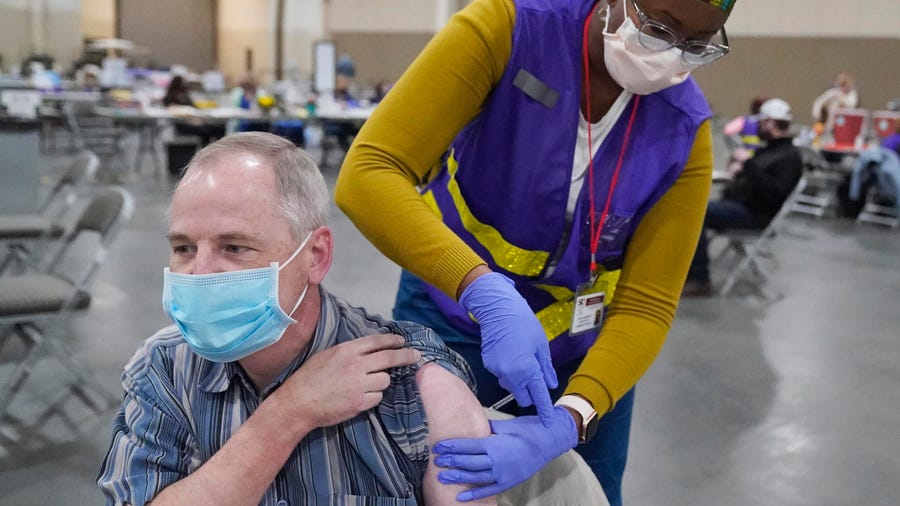 Garry Garff receives his Pfizer COVID-19 vaccination March 10 in Sandy, Utah.