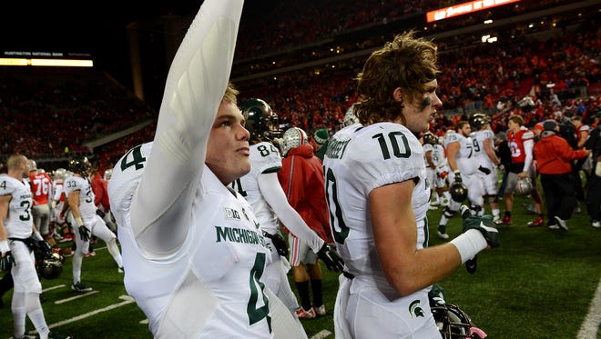 Kicker Michael Geiger (4) cheers with teammates after kicking the game-winning field goal as time expired to give the Spartans the 17-14 victory over Ohio State Saturday November 21, 2015, at Ohio Stadium in Columbus, Ohio. 