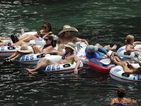 Tubers float on the Comal River in New Braunfels, Texas, despite a recent spike in COVID-19 cases in the state. Texas Gov. Greg Abbott has again halted elective surgeries in the state’s biggest counties in a bid to free up hospital beds as the number of patients admitted with COVID-19 has more than doubled in two weeks.