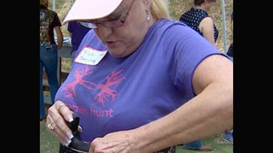 A woman with a concealed handgun license learns about female-friendly ways to carry a weapon, in this case with a corset holster.