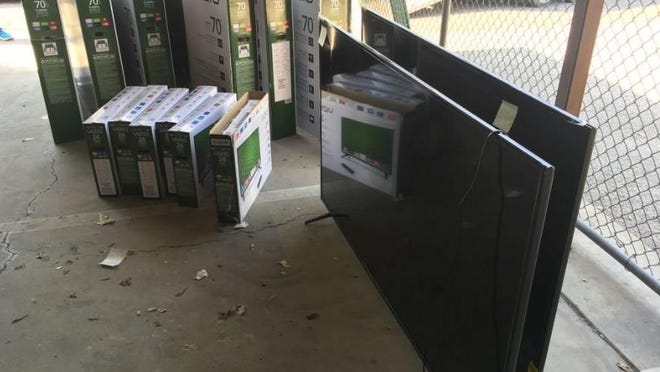 Televisions believed to have been stolen from Ridgeview Middle School, under construction in Visalia. Police say a contracted security guard is a suspect in thefts of 35 new televisions at the site.