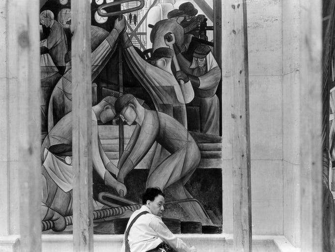 Diego Rivera finishes a panel on the Detroit Industry