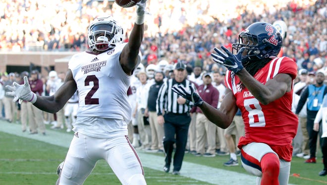Mississippi State defensive back Jamal Peters (2) reaches up and intercepts a pass intended for Mississippi wide receiver Quincy Adeboyejo (8) in the end zone in the first half of the Egg Bowl Saturday in Oxford.
