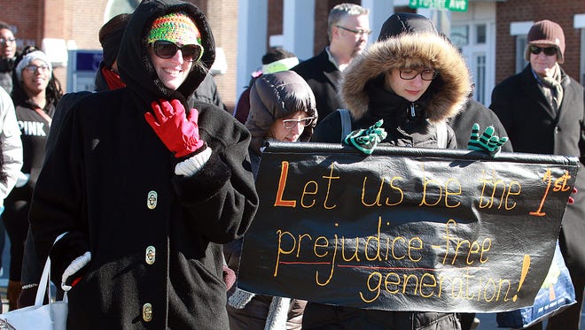 Marchers share their dream with a banner during the Unity Day march in Gallatin on Jan. 18, 2016.