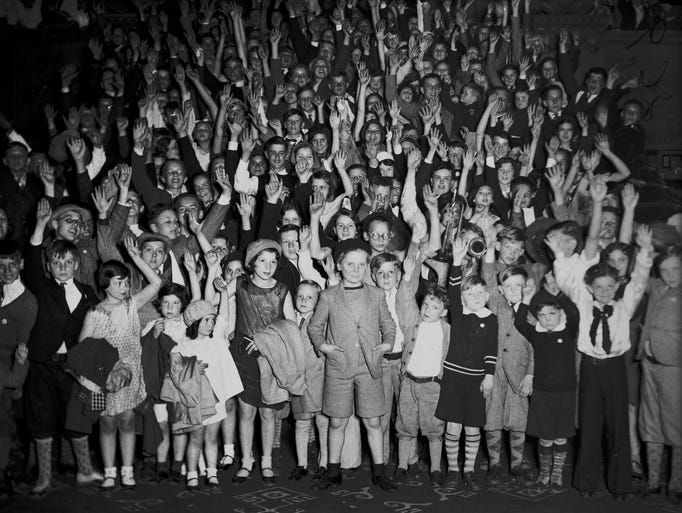 Movie star Jackie Cooper, center, is surrounded by