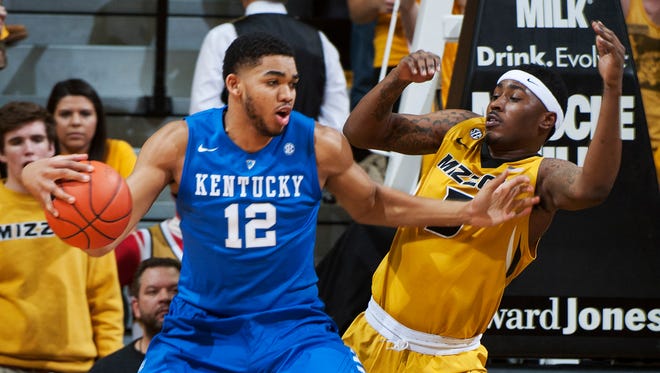 Kentucky's Karl-Anthony Towns, left, pushes past Missouri's D'Angelo Allen on a drive to the basket during the first half of an NCAA college basketball game Thursday, Jan. 29, 2015, in Columbia, Mo. (AP Photo/L.G. Patterson)