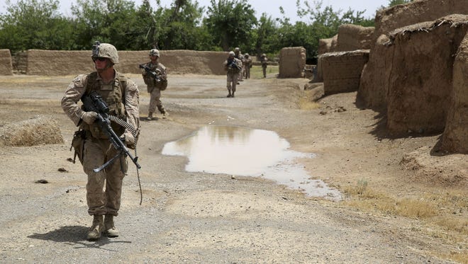 Marines patrol in Helmand province, Afghanistan, on May 15, 2014. Veterans say that concerns about being stigmatized have prevented them from seeking help for mental health and combat-related conditions.