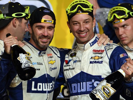 Jimmie Johnson (left) and crew chief Chad Knaus celebrate