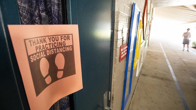 Social distancing signs were placed at Oakcrest Elementary School in April during the local school district's lauch of distance learning.