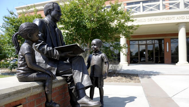 A statue of Cecil Picard, a deceased educator and former Louisiana state superintendent of education, sits in front of  the Cecil J. Picard Center for Child Development and Lifelong Learning in Lafayette.