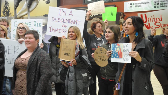 People protested President Trump's executive order on immigration at the Reno-Tahoe International Airport Saturday, Jan. 28, 2016.