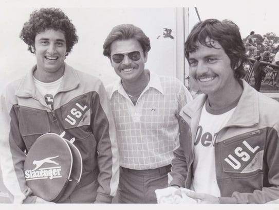 Former UL tennis coach Jerry Simmons, center, - shown