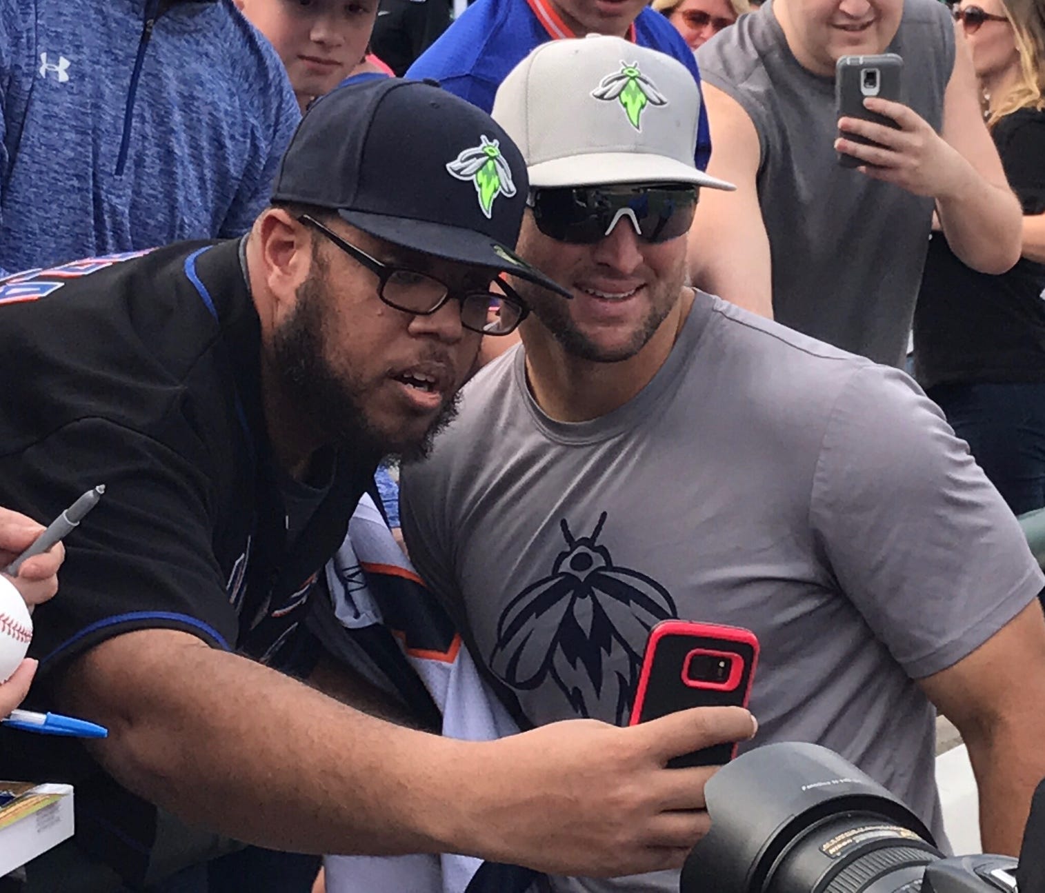 Tim Tebow takes a selfie with John Herrera of New York City at  FirstEnergy Park on Tuesday.
