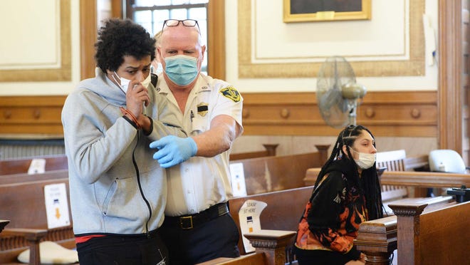 Alyssa Joyette, 19, of Brockton, right, and Tyleke Curry, 22, of Stoughton, are arraigned on Friday, Oct. 23, 2020, in Norfolk County Superior Court in Dedham on a charge of accessory after the fact of murder in connection with the July fatal shooting in Stoughton of Christian Vines, 17, of Randolph.