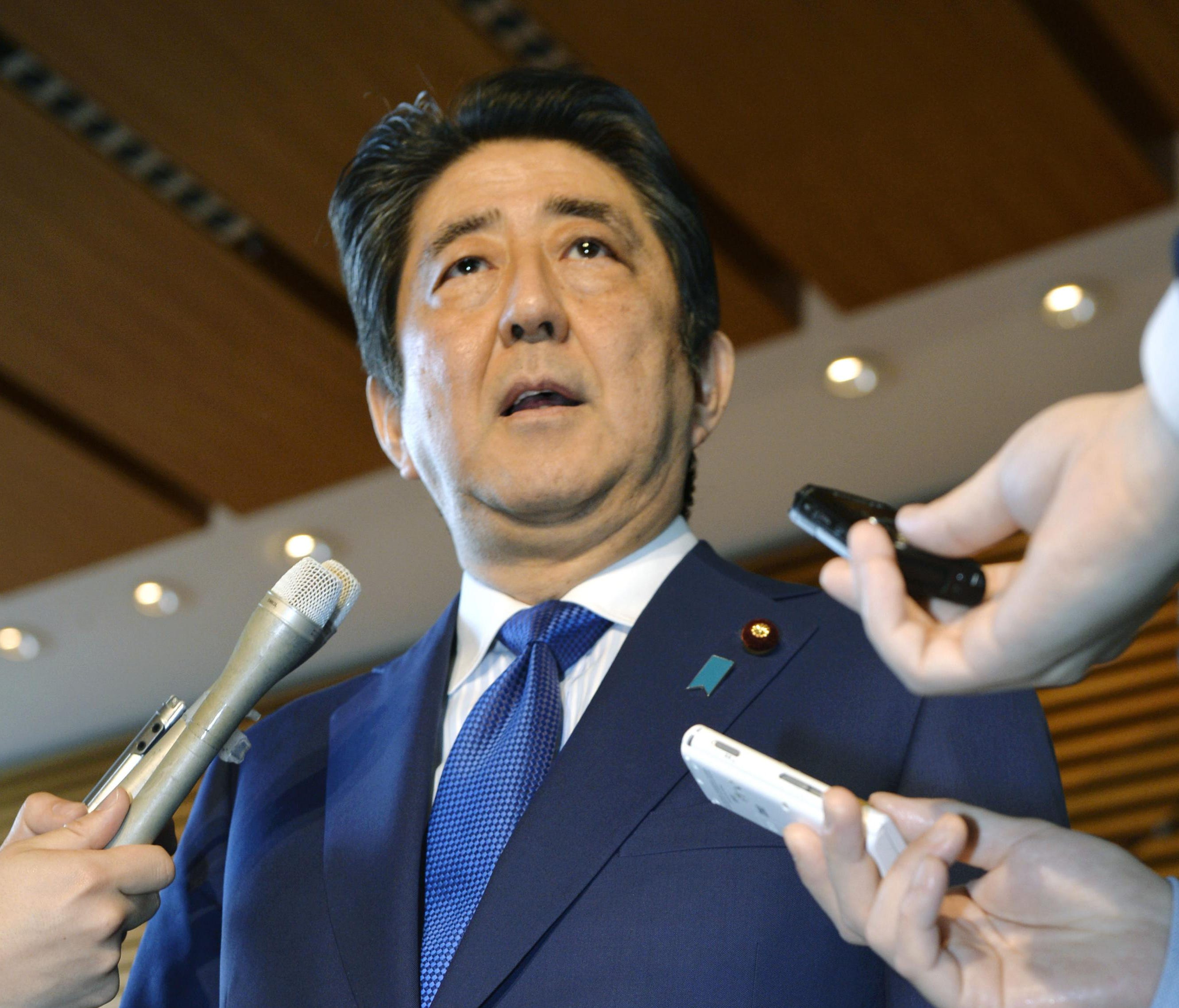 Japanese Prime Minister Shinzo Abe speaks to the media as he expresses support for the U.S. missile attack on a Syrian government-controlled air base at his official residence in Tokyo Friday, April 7, 2017.