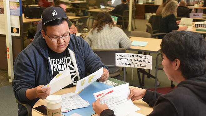 Sophomore tutor Desmon Tippeconnie, left, and freshman tutor Adriano Tsinigine spend time in the Student Success Center on Friday at San Juan College in Farmington.