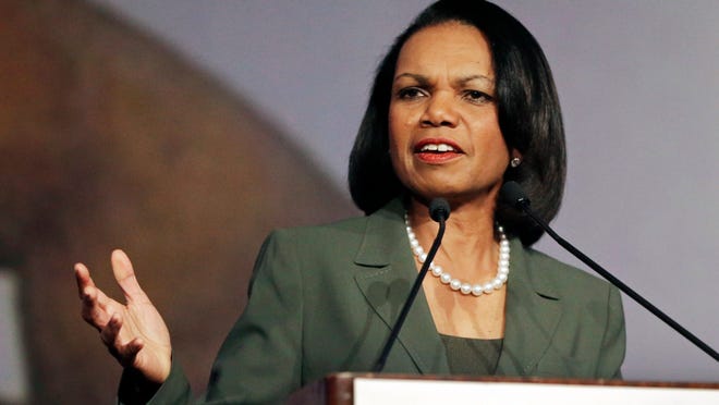 FILE - In this March 15, 2014, file photo, former Secretary of State Condoleezza Rice gestures while speaking before the California Republican Party 2014 Spring Convention in Burlingame, Calif. More than two dozen universities with major basketball programs _ including Louisville, where Hall of Fame coach Rick Pitino is in the process of being fired after 16 seasons _ have responded to news of the sport's bribery scandal by conducting internal reviews of their compliance operations.  The NCAA formed a fact-finding commission to be led by former Secretary of State Condoleezza Rice, with results expected in April. (AP Photo/Ben Margot, File)