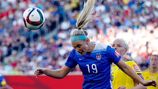 United States defender Julie Johnston (19) heads the ball in front of Sweden defender Nilla Fischer (5) during the second half  in a Group D soccer match in the 2015 FIFA women's World Cup at Winnipeg Stadium Friday.