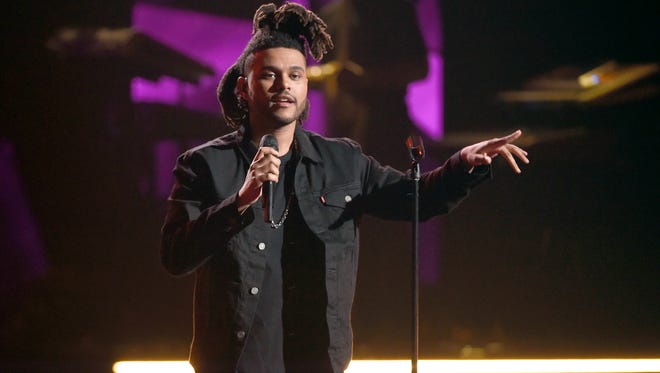 The Weeknd performs at the BET Awards on June 28, 2015, in Los Angeles. The R&B singer's new album, 'Beauty Behind the Madness,' is out Friday.