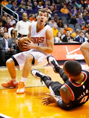 Phoenix Suns guard Goran Dragic collides with Portland Trail Blazers star Damian Lillard on Jan. 21, 2015, in Phoenix.