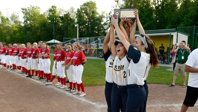 Victor captains hoist the championship block after winning the Section V Class AA championship game at SUNY Brockport, Wednesday, May 30, 2018. No. 1 seed Victor won the Class AA title with a 11-2 win over No. 2 seed Fairport.