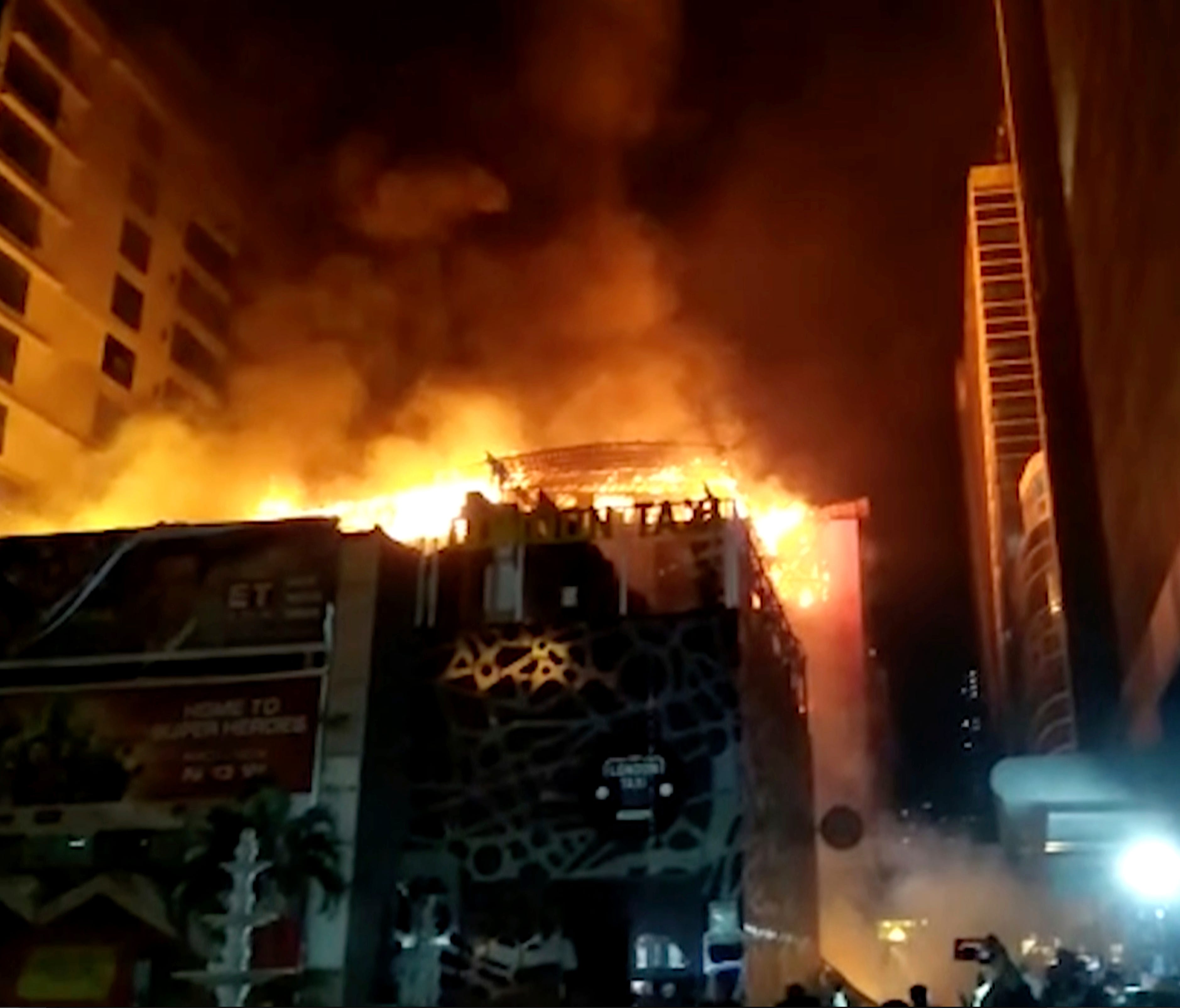 In this image made from video, a building is on fire in Mumbai, India, early Friday, Dec. 29, 2017.