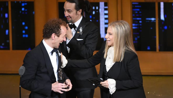 Barbra Streisand, right,  presents the award for best musical to Lin-Manuel Miranda, center, Jeffrey Seller and the cast of "Hamilton" at the Tony Awards on Sunday at the Beacon Theatre in New York.