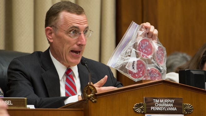At a July 2014 hearing on lab incidents at the Centers for Disease Control and Prevention, U.S. Rep. Tim Murphy, R-Pa., chairman of the House Energy and Commerce Committee's oversight and investigations subcommittee, holds up a Ziploc bag as an example of how pathogenic agents were handled at the CDC.