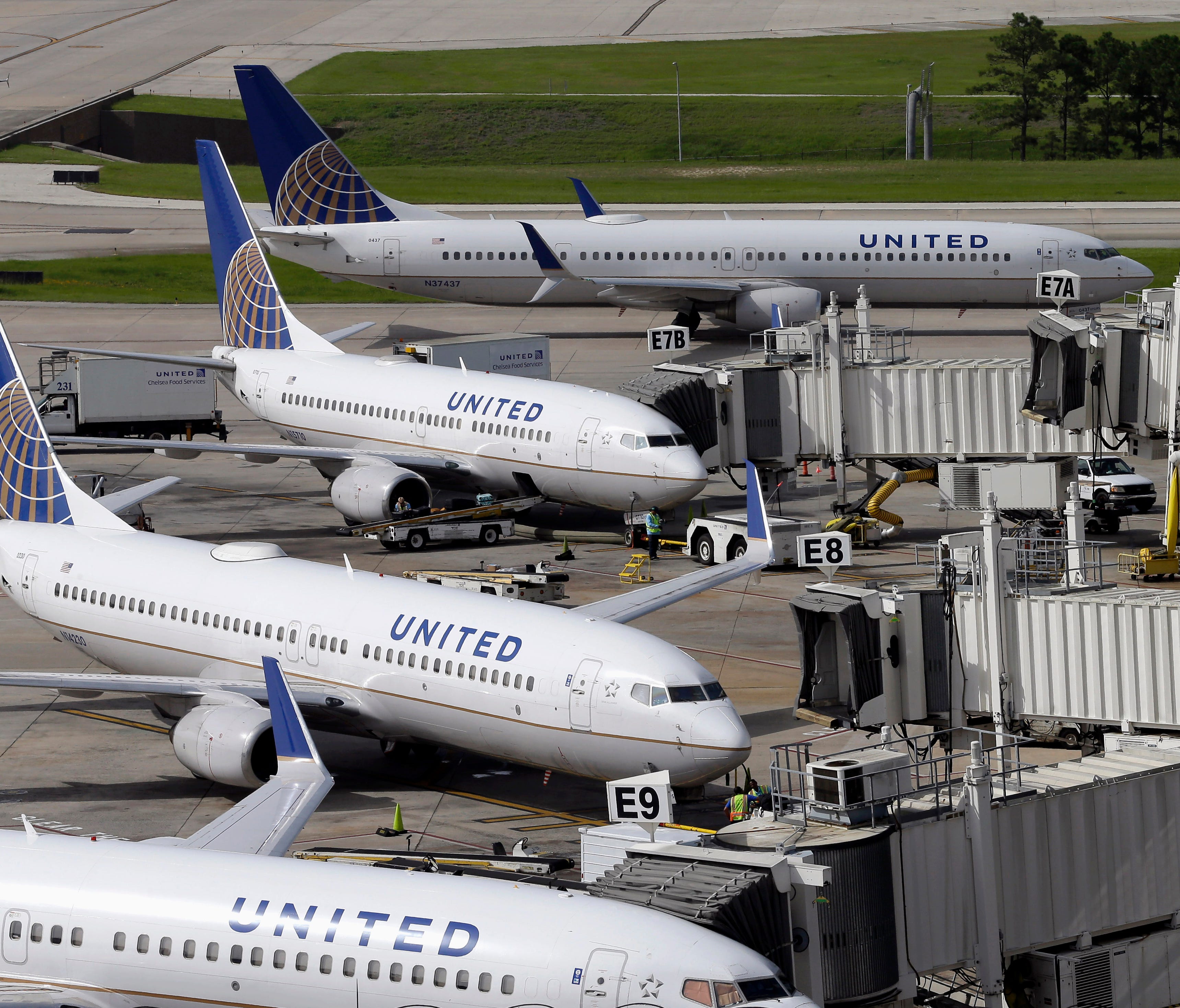 United Airlines planes wait at the gates at Houston George Bush Intercontinental Airport.