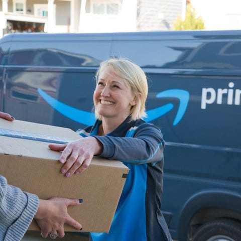 Woman delivering an Amazon package