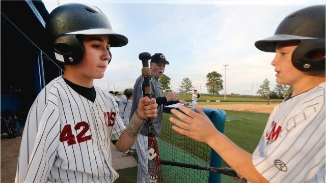 One-armed catcher excels on baseball diamond
