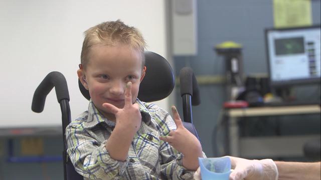 7-year-old faces health challenges but still makes everyone smile