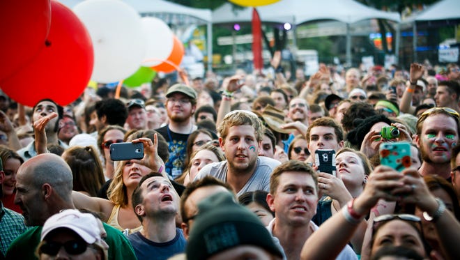 Faces in the crowd during The Flaming Lips set the final evening Sunday, July 12, 2015, of the Common Ground Music Festival at Adado Riverfront Park in downtown Lansing.