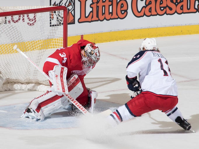 Detroit goalie Petr Mrazek stops a shot by Columbus