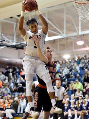 Dallastown's Justin Atwood grabs a rebound against