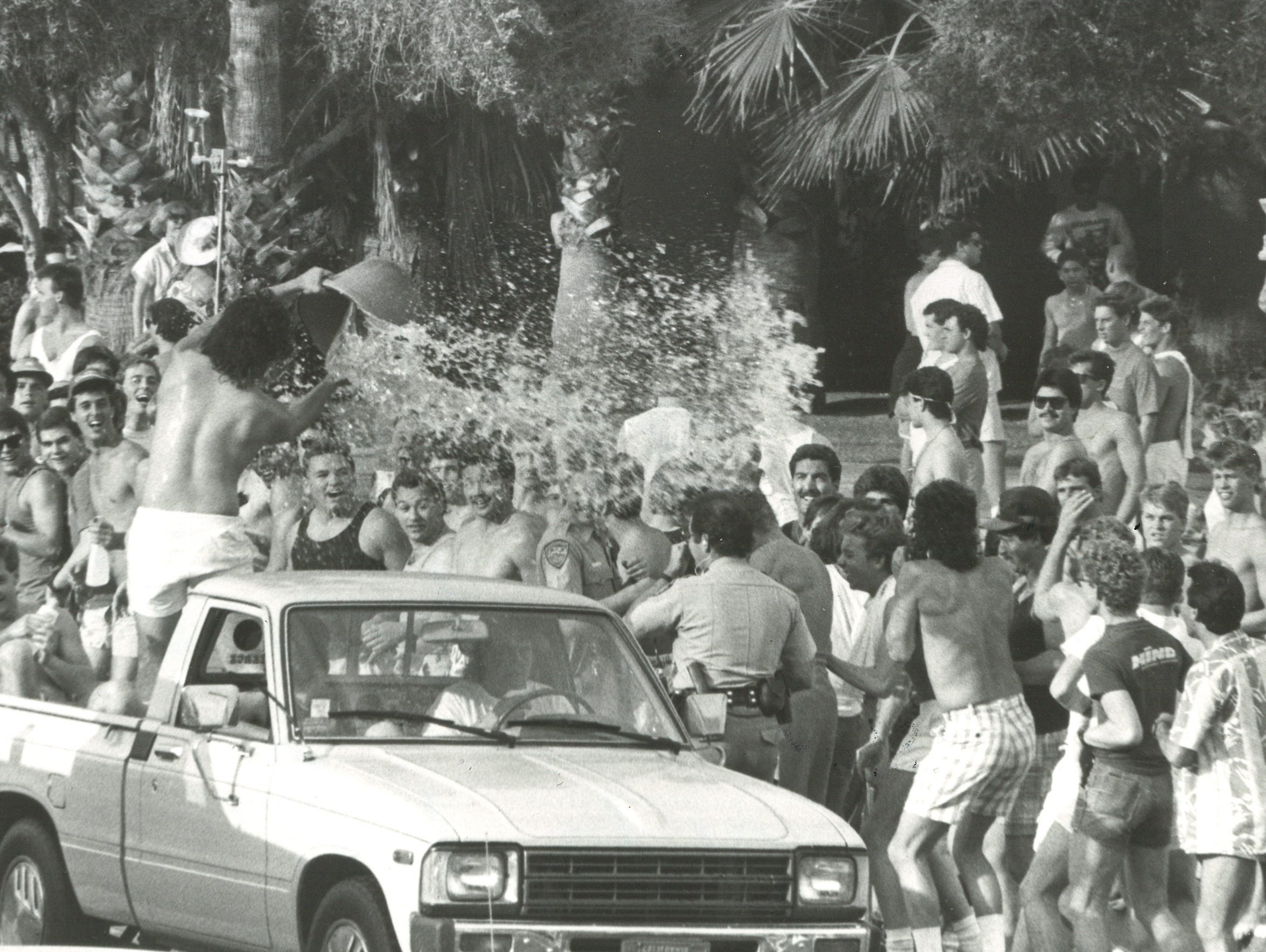 A spring breaker dumps water on police officers in