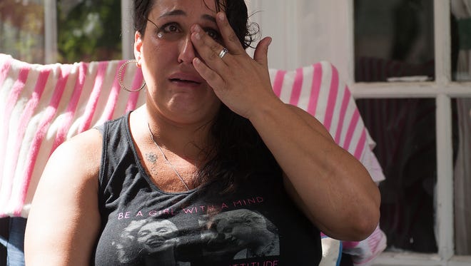 Bonnie Smith  wipes tears from her face during an interview with the Courier-Post at her home in Waterford Works. Smith lost her 21-year-old daughter, Emily, due to substance use. "I want kids to know what they're sentencing their parents to and their family to by taking drugs and doing heroin," Smith said. "It's horrible. It's hell."