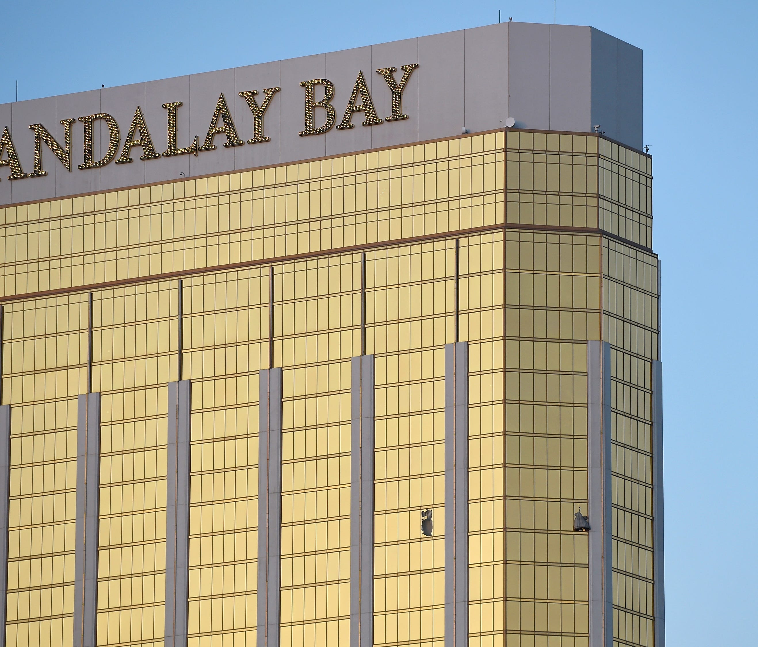 Broken windows are seen on the 32nd floor of the Mandalay Bay Resort and Casino after a lone gunman opened fired on the Route 91 Harvest country music festival on Oct. 2, 2017, in Las Vegas.