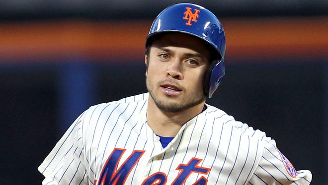 The Mets' Travis d'Arnaud rounds the bases after hitting a three-run homer against the Oakland Athletics in the third inning at Citi Field on Tuesday.